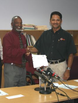 hon_ambrose_george_with_ian_singh_of_dipcon_engineering_services_limited.jpg