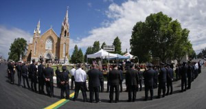 Emergency responders form an honor guard prior to a memorial mass at the Sainte-Agnes church in Lac-Megantic